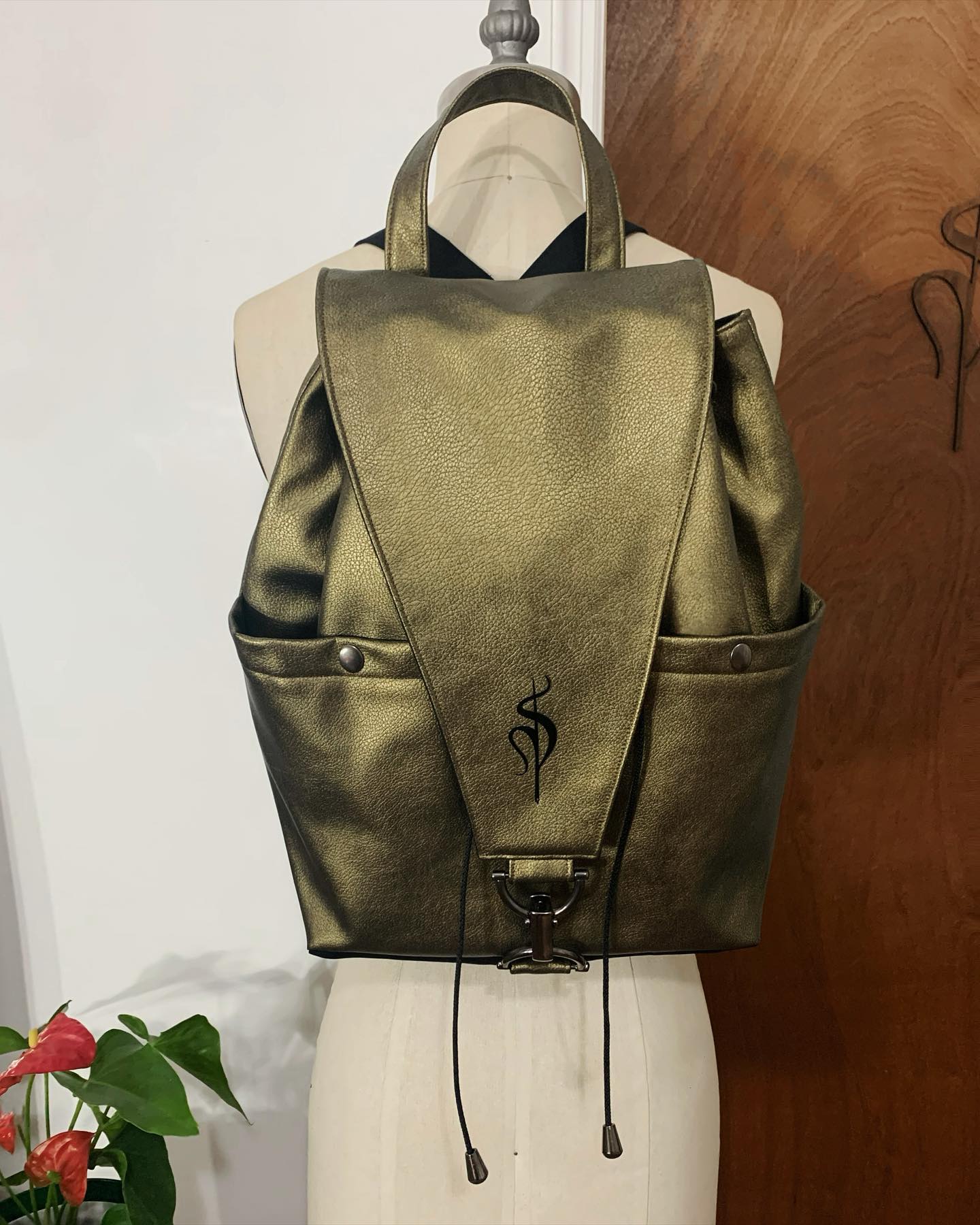 Bronze metallic leather backpack with the S monogram